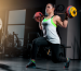 fit-young-woman-lifting-barbells-looking-focused-working-out-gym 1